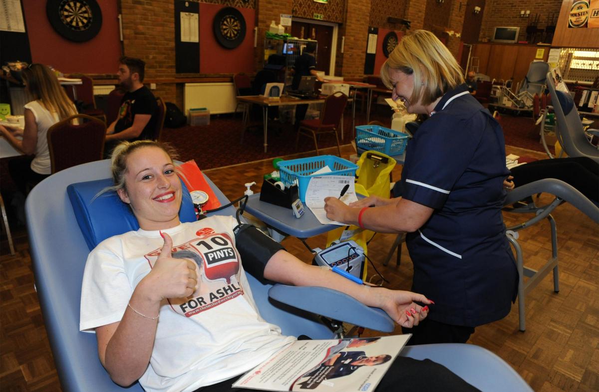 Ashley's cousin Gail gives a thumbs up during her donation