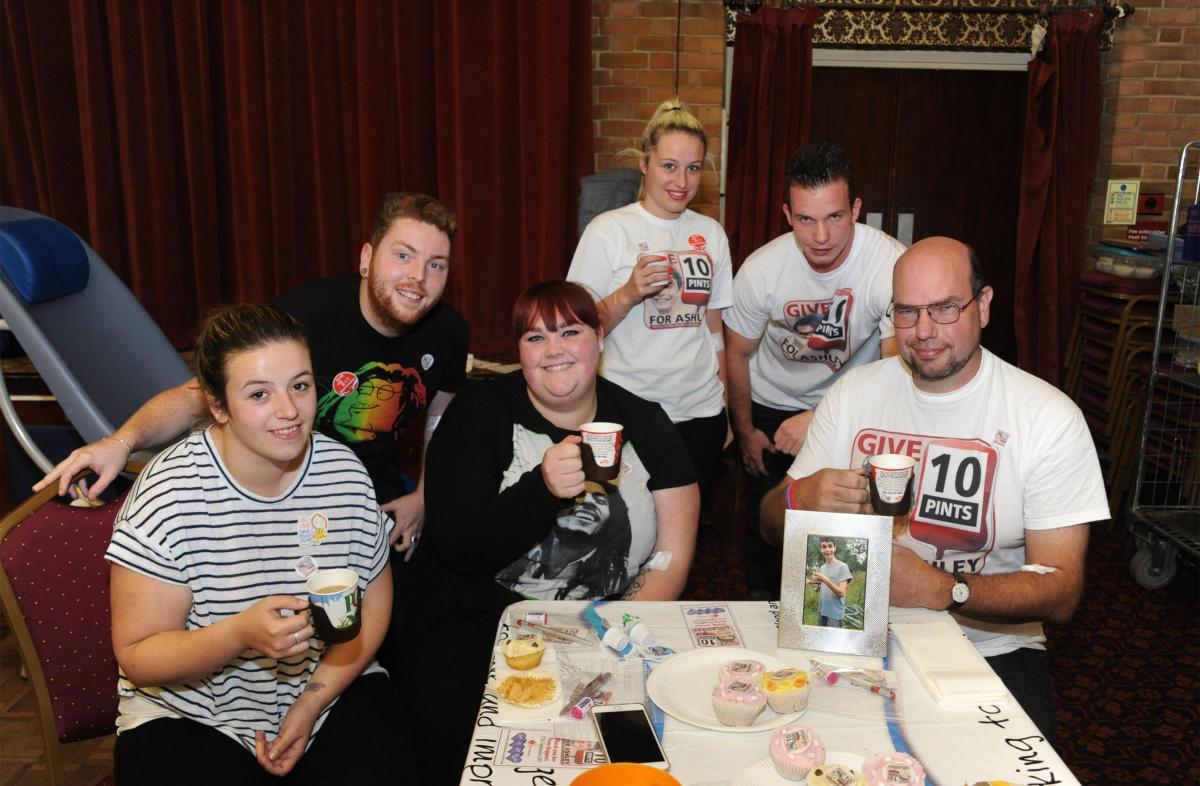 Ashley's family and friends recover with a cup of tea and a cupcake after giving blood
