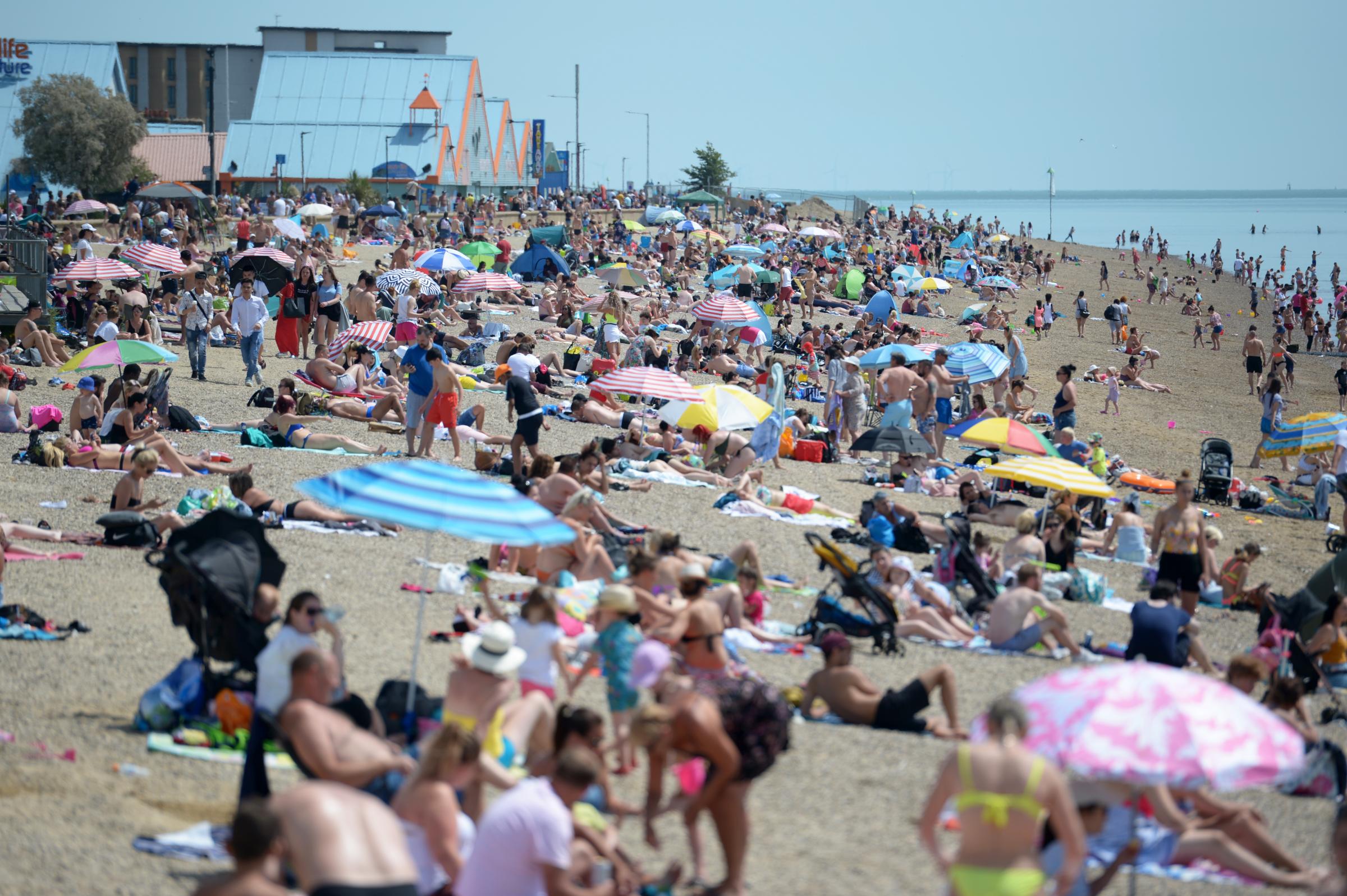 People enjoying the good weather on the beach at Southend-on-Sea in Essex, as the public are being reminded to practice social distancing following the relaxation of lockdown restrictions in England..