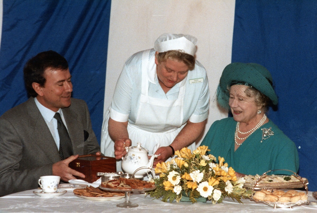 Taking tea - chairman Christopher Holmes enjoys refreshments with the royal guest, prepared by assistant cook Doreen Hill
