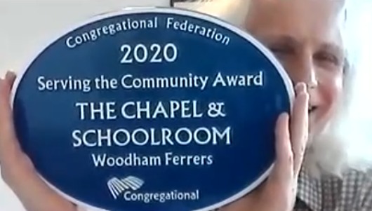 Minister Eric Fenwick with the plaque awarded to The Chapel and School Room in Woodham Ferrers