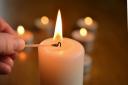 Stock image of candle being lit. Photo - Pixabay
