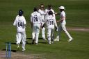 Well done - Essex's Simon Harmer celebrates with his team mates after taking the wicket of Ed Barnard Picture: GAVIN ELLIS