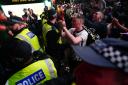 England fans clash with police in Piccadilly Circus, London, after Italy beat England on penalties. Picture: PA