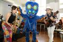 Hitting the right note - Octopus Ahoy! mascot CJ rocked out with Mambo Jambo at the Harwich Arts and Heritage Centre, as part of this year's Harwich Festival of the Arts Picture: STEVE BRADING