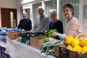 Cemlyn Williams pictured with volunteers Alun Roberts, Ann Hopcyn and Eleri Lovgreen at Porthidre's weekly food-share scheme in Caernarfon. Picture: Dale Spridgeon