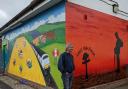 Artist Keith Hollingsworth with the new mural at South Woodham Ferrers rail station