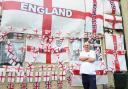 Carer Paul has strung up 22 individual St George's Crosses - plus dozens more on bunting - outside his semi-detached home in Chelmsford
