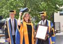 Briony receiving her award from Professor Roderick Watkins and ARU Chancellor, Lord Ribeiro