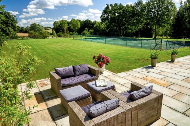 Chelmsford Weekly News: Spacious - outside you will find plenty of garden space, alongside a tennis court and seating area