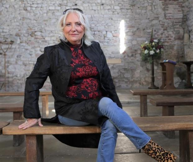 Chelmsford Weekly News: Martina Cole is pictured at St Peter's Chapel on the Wall, Bradwell. Picture: Visit Essex/BigWavePR
