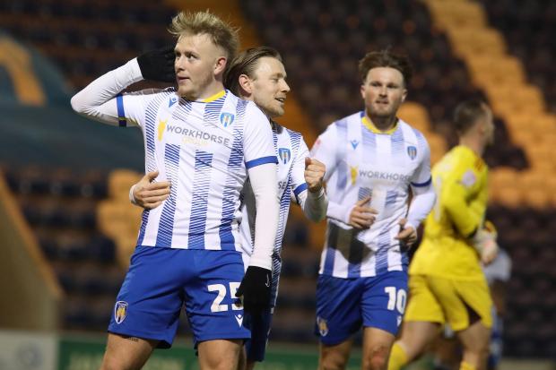 Listen up - Joe Taylor celebrates scoring Colchester United's opener in their 2-1 win over Salford City