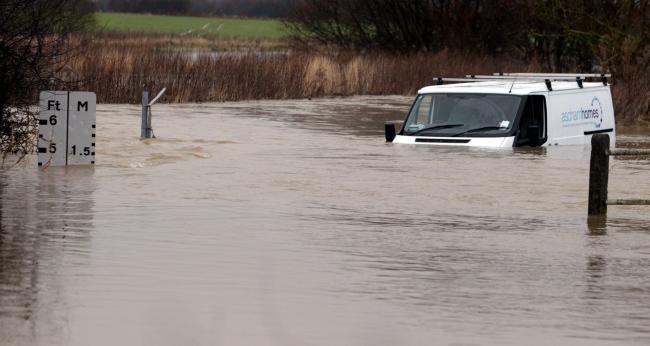 The van had to be pulled out five feet of rising flood waters [Pics: Stephen Huntley]