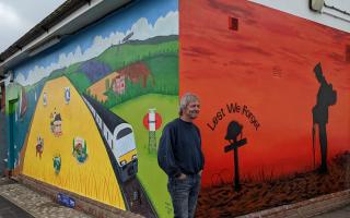 Artist Keith Hollingsworth with the new mural at South Woodham Ferrers rail station