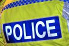 Newsagent employee held up at knifepoint in robbery